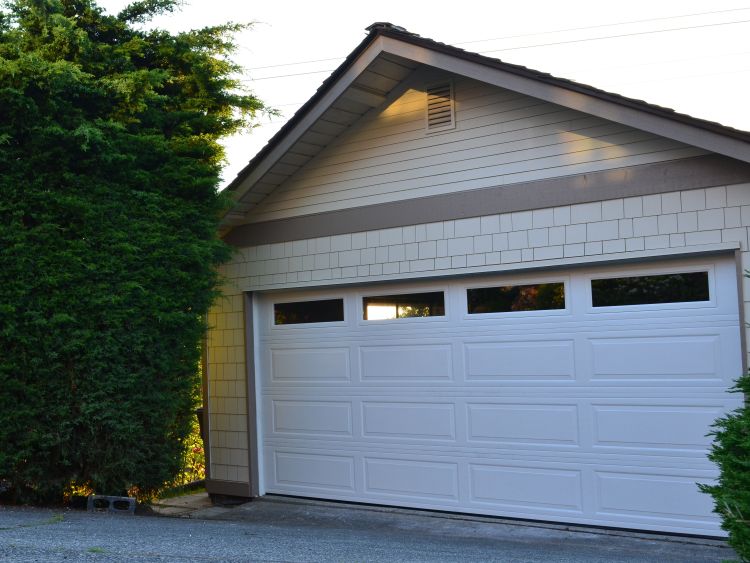Siding Around Garage Door Of A Renton Wa Home Gets Replaced By Gab Construction